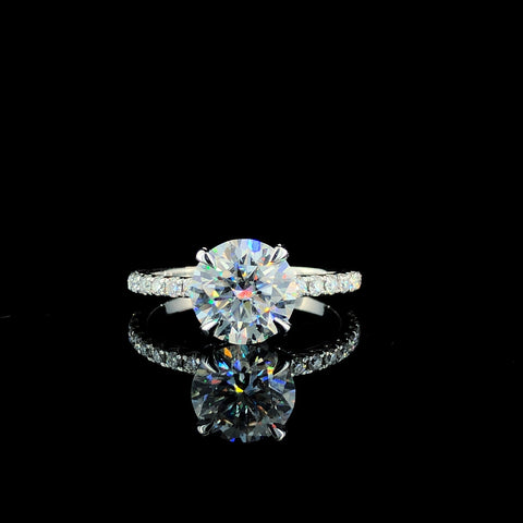 Rose gold Round Brilliant Solitaire with Pavé Band and Four-Prong Setting