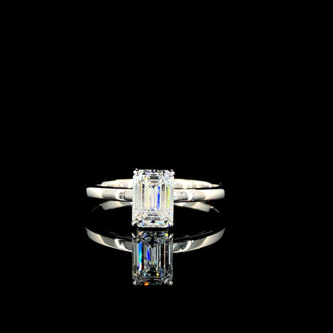 Emerald Solitaire Engagement Ring with Silver Band and Four-Prong Setting
