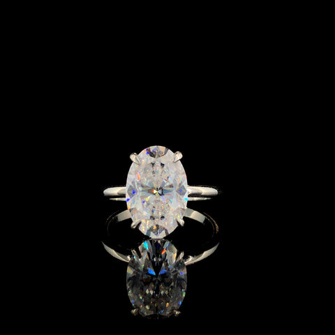 Silver Oval Solitaire Ring with Four-Prong Setting on a Classic Band